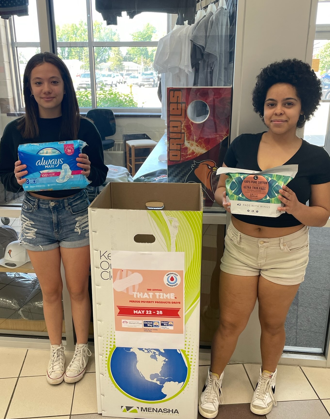 Girls with product donation box